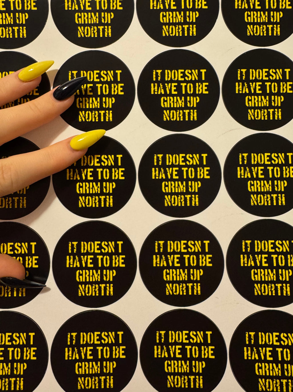 'it doesn't have to be grim up north' badge & sticker pack